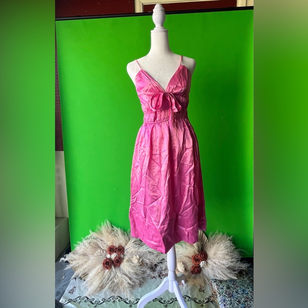 Bright pink like satin material women’s dress